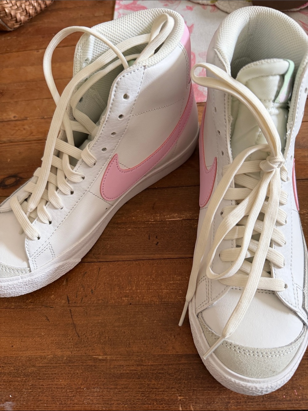 Nike Women’s High-Top Sneakers in White with Pink Swoosh